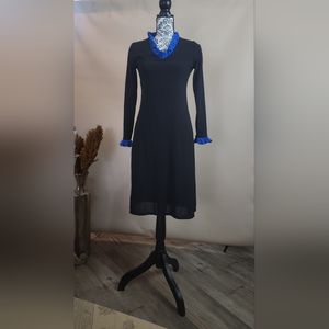 Black dress with blue neck and wrist ruffle trim